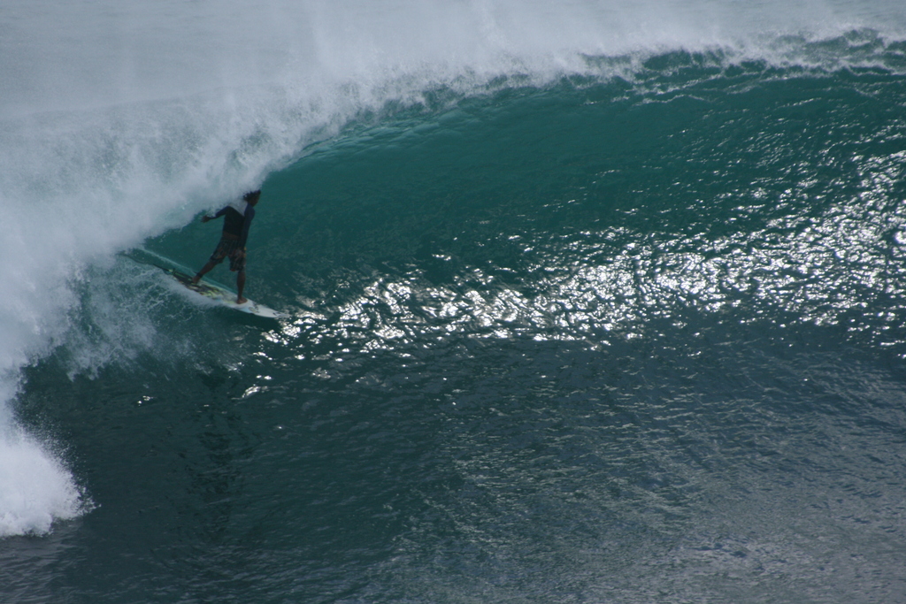 Surfer entering the Tube at Padang-Padang, Bali, Indonesia