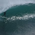 Surfer entering the Tube at Padang-Padang, Bali, Indonesia