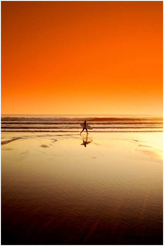 Surfer running