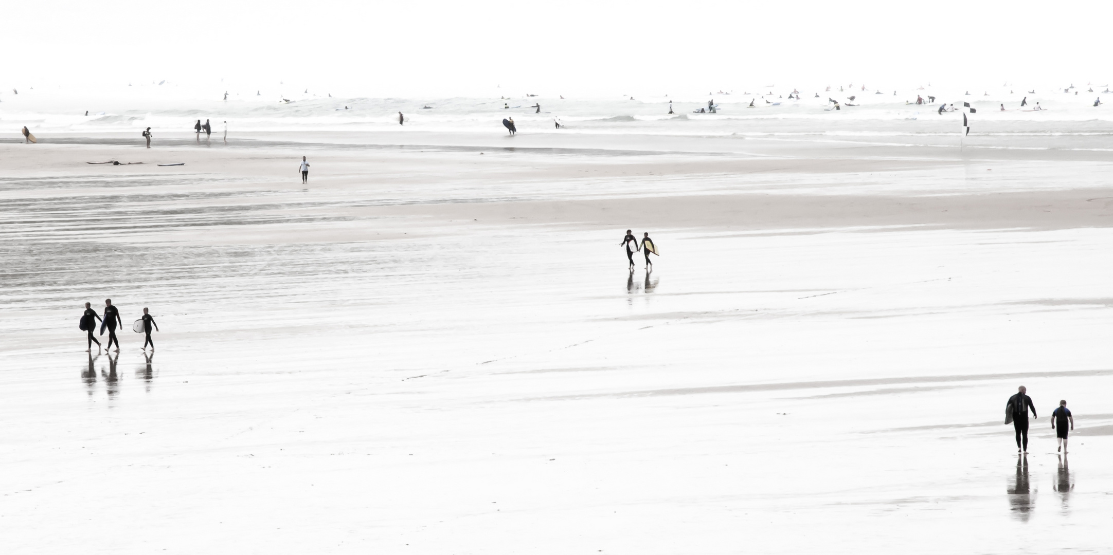 Surfers at Fistral Beach, UK