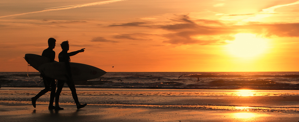 Surfers at Rømø Sunset, Danemark