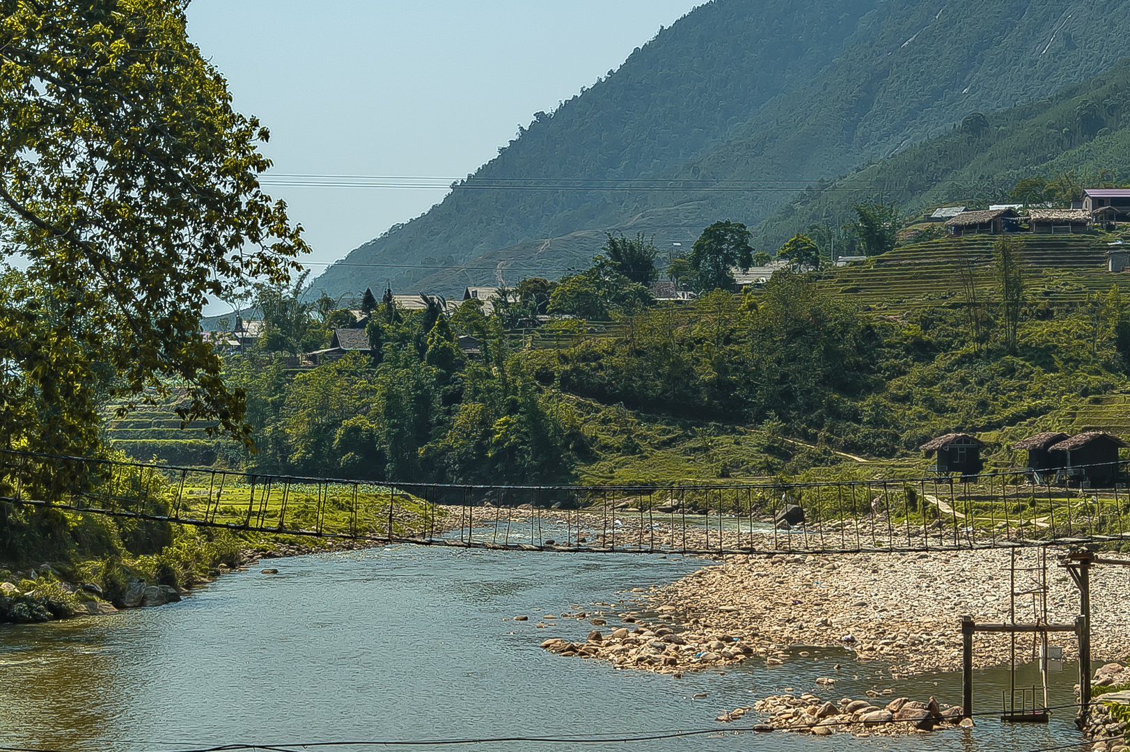 Suspension bridge over Muong Hoa river