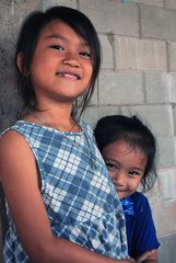 Sweet little sisters pose for a photo shot