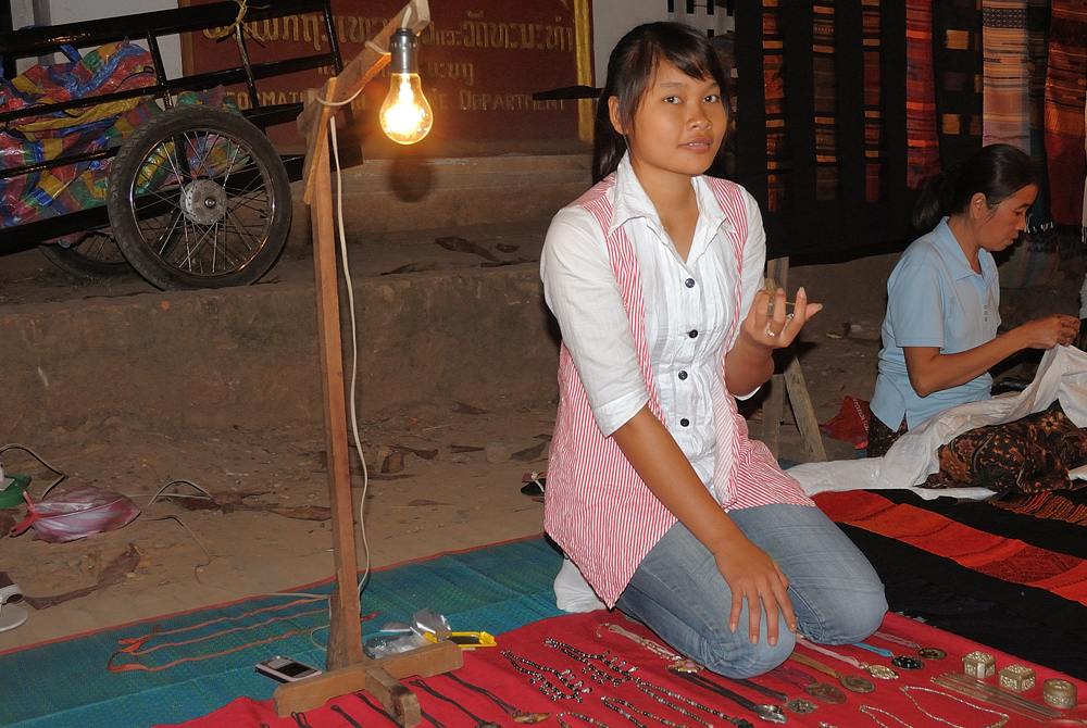 Sweet vendor girl at the night market in Luang Prabang