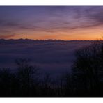 swiss alps over mist