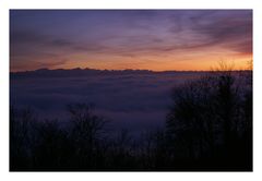 swiss alps over mist