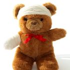 Symbolbid Teddybär mit Verband