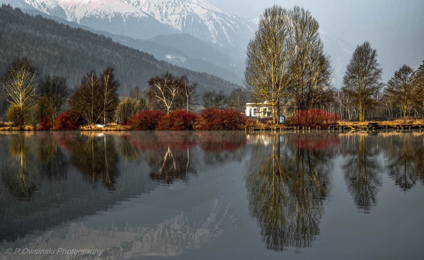 Symmetric Reflections On Calm Lake.