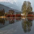 Symmetric Reflections On Calm Lake.