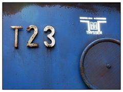 T23