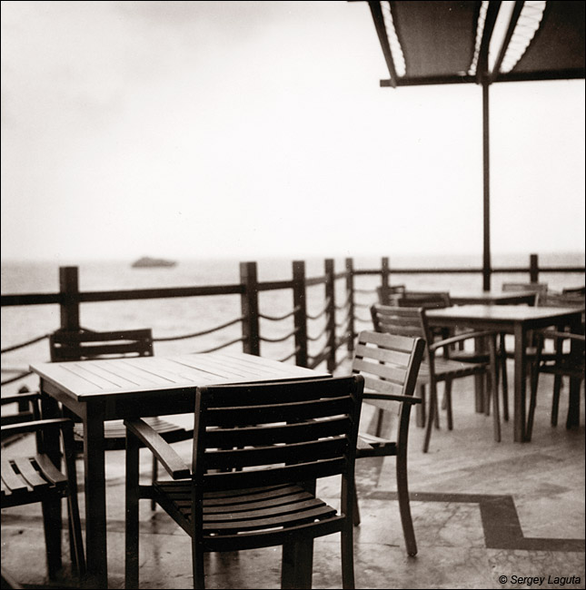 Table in cafe with a view of the sea