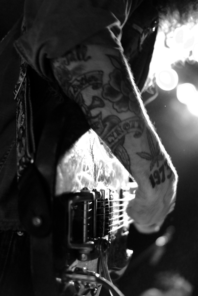 Tattoo-armed guitar