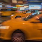 Taxi Cabs in a rainy night