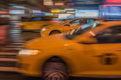 Taxi Cabs in a rainy night