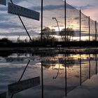 Tennisplatz bei Sonnenuntergang - Spiegelung