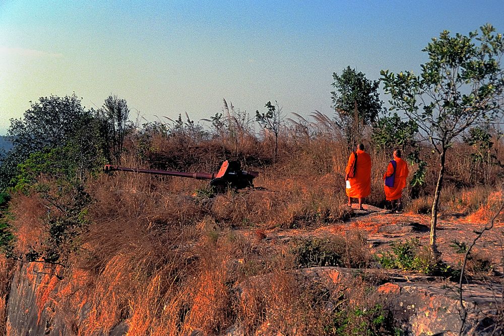Thai monks visiting the remains of killing machines