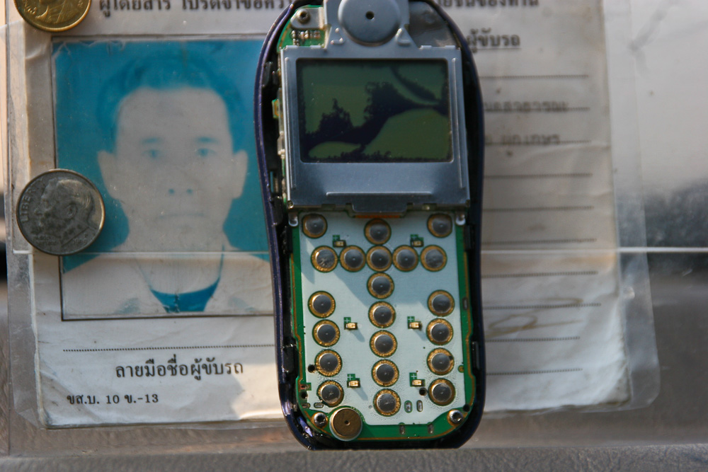 Thailand - Das Handy des Taxifahrers