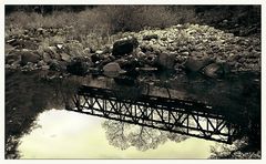 the bridge in the mirror of the river