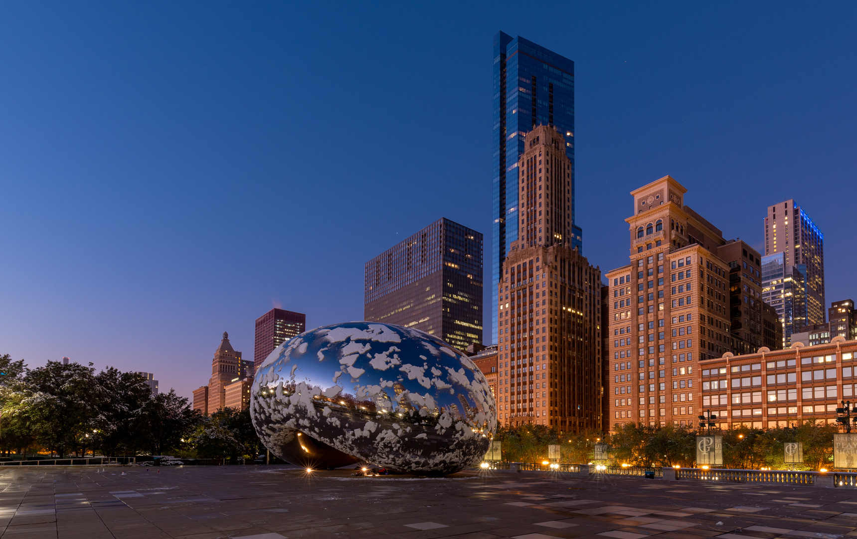 The Cloud Gate in Chicago with some Snow on top .