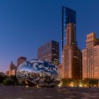 The Cloud Gate in Chicago with some Snow on top .