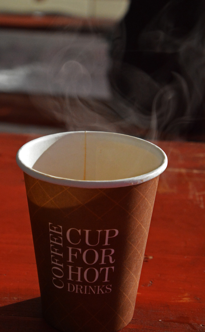 The cup of cafe in the outside