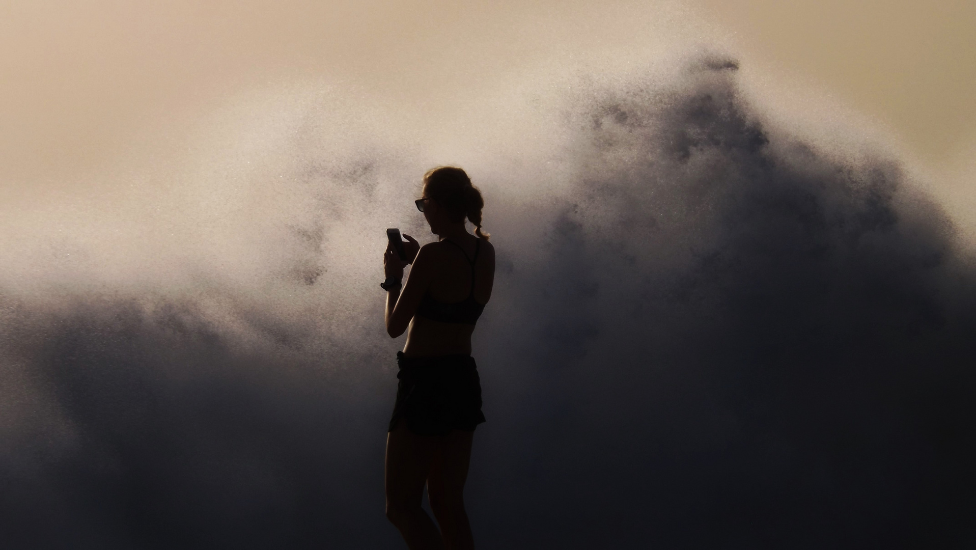 The Girl, Her Phone and the Ocean Wave