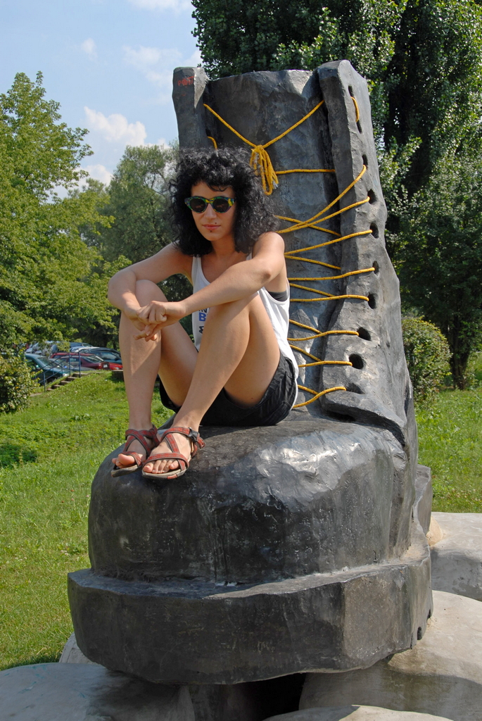 The girl on a monument of punk boot