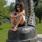 The girl on a monument of punk boot