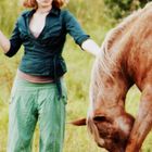 The green Girl with red hair and the brown Horse