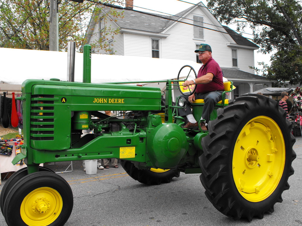 The green old  John Deere tractor