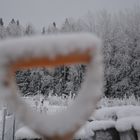 The handle of spade on winter scene