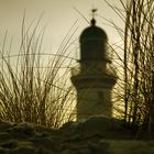 the lighthouse behind the dune