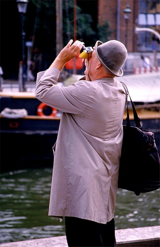 ...the man with the yellow camera...