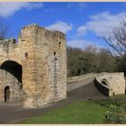 the medieval bridge and gate at warkworth