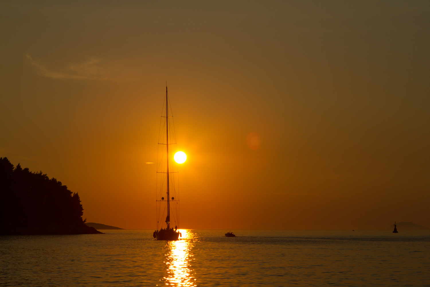 The Obligatory Boat Sailing into the Sunset Shot