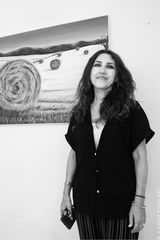 The painter with one of her works