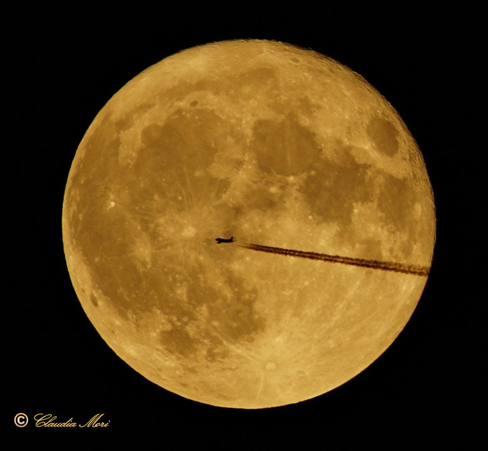 The plane and the full moon