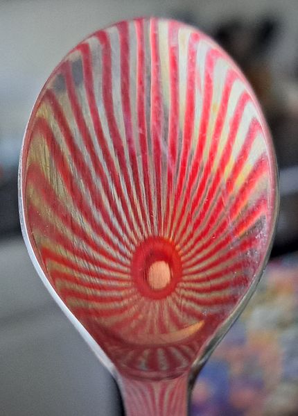 The reflection on the spoon