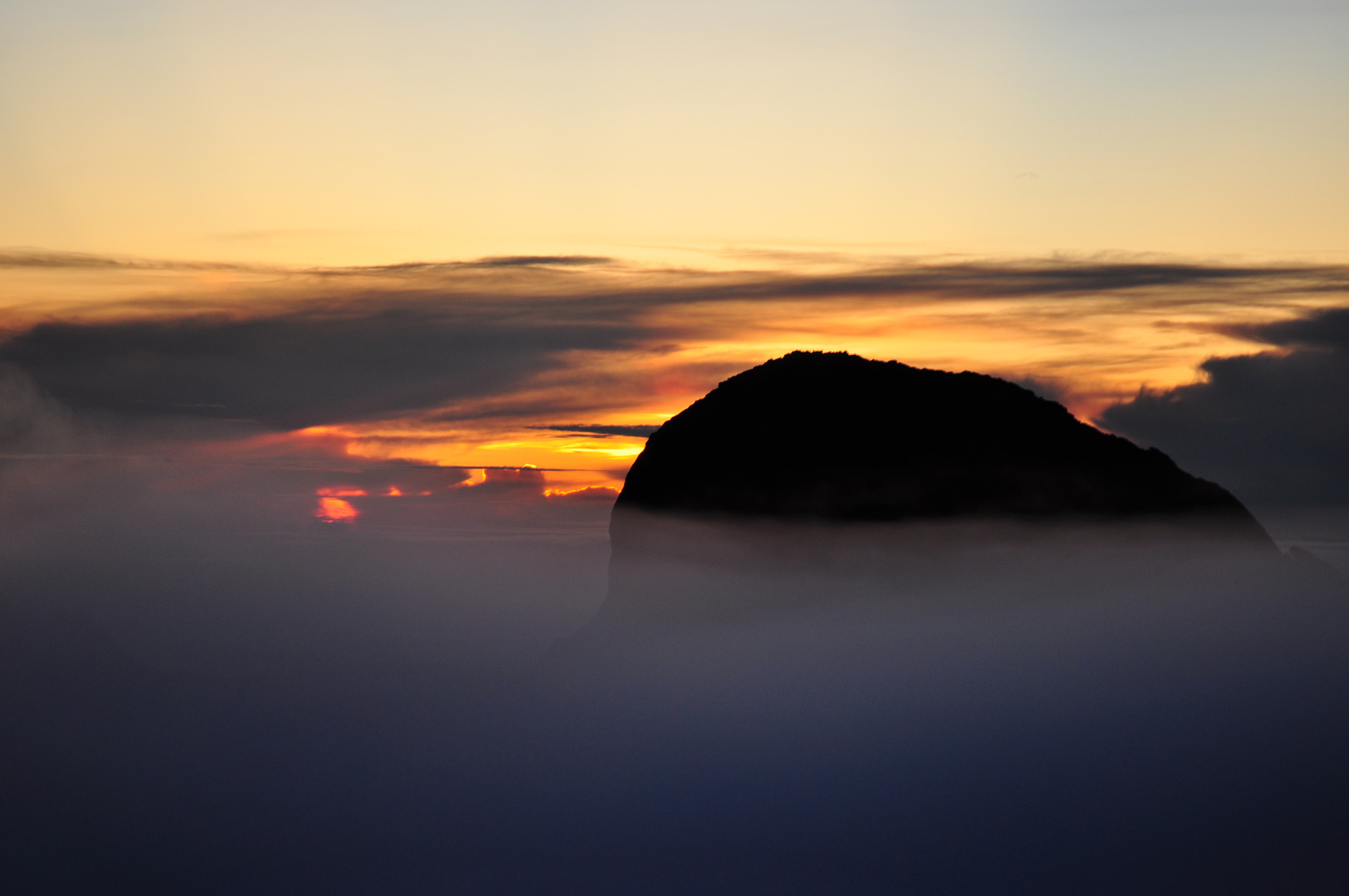 the rising sun on the top from the mount kinabalu