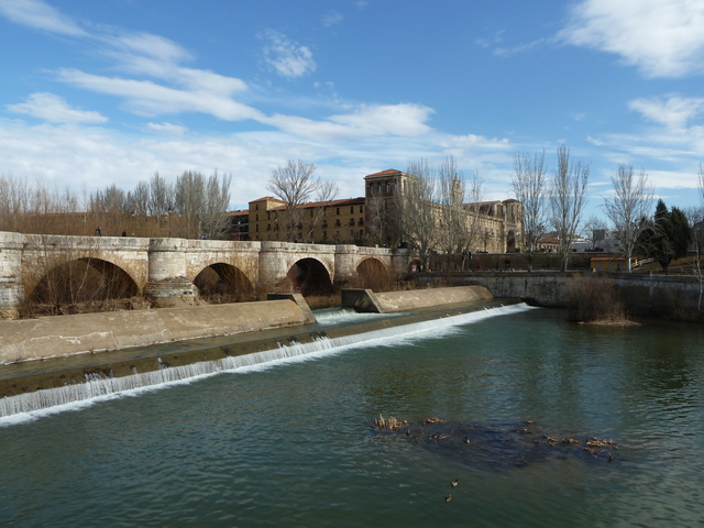 The Roman bridge over Rio Bernesga and Parador San Marcos Leon Spain