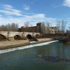 The Roman bridge over Rio Bernesga and Parador San Marcos Leon Spain