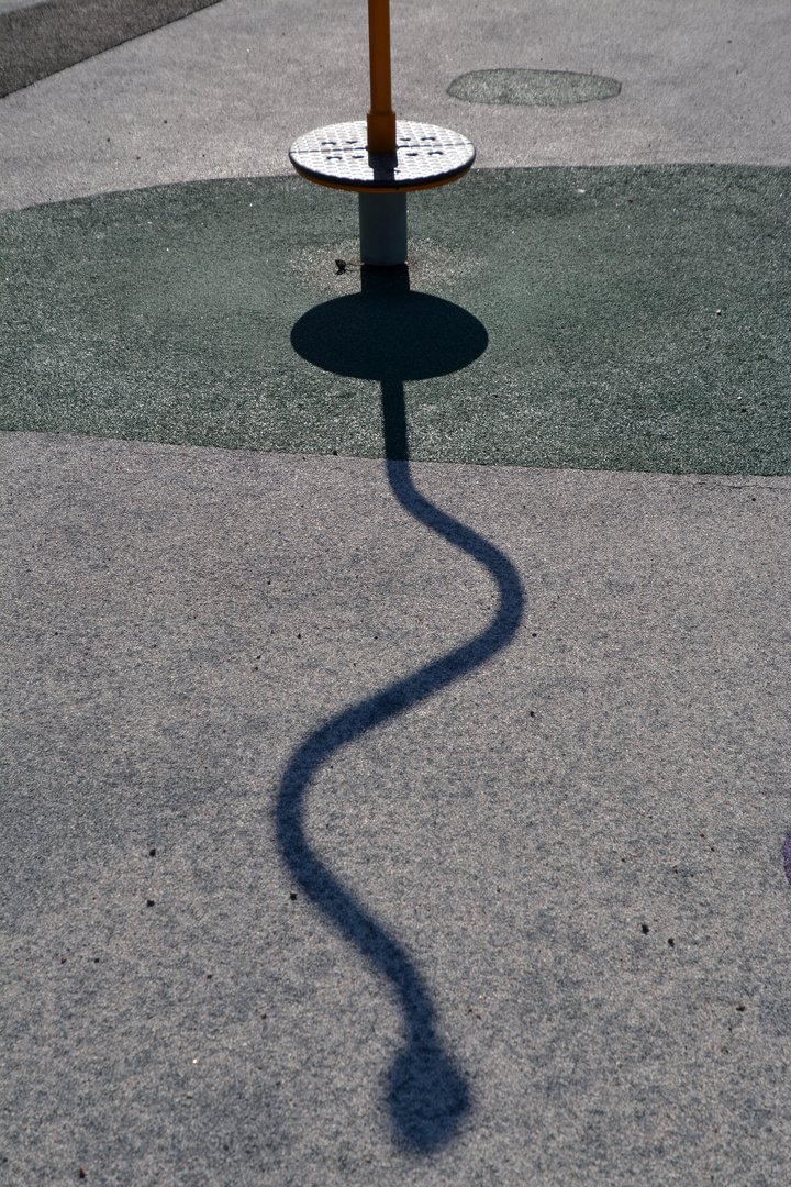 The shadow of  playing equipment on park