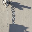 The shadow of water tap and the chain