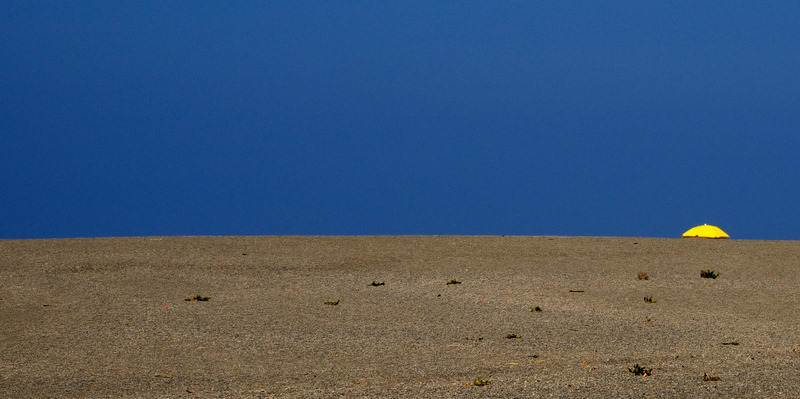 The small yellow beach umbrella