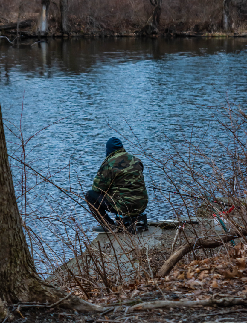 The Solitude of the Fisherman in Winter