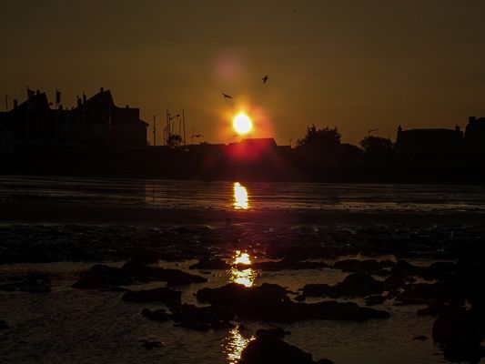 the sun shines on the sand 