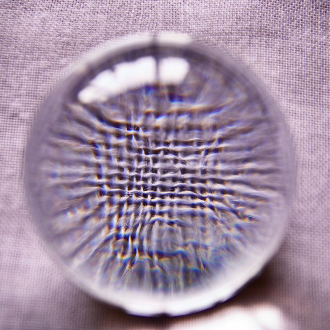 The vortex of looking through a glass bowl into fabric