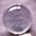 The vortex of looking through a glass bowl into fabric