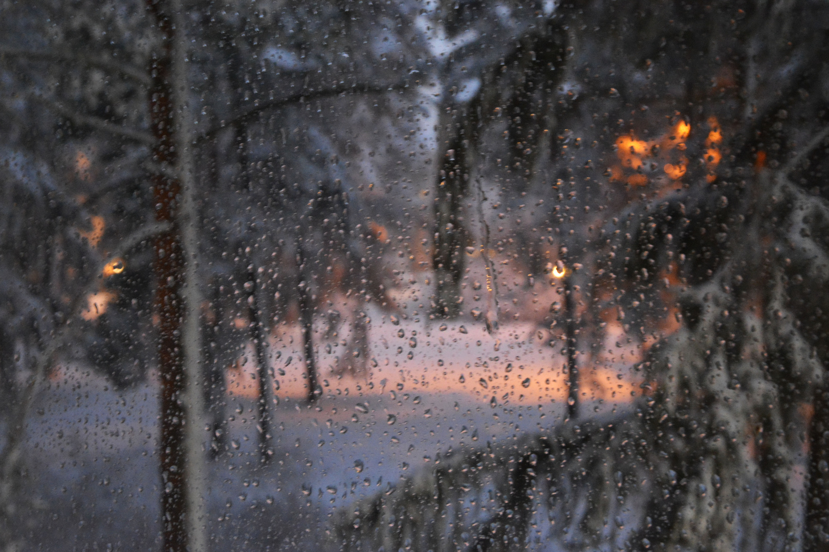 The wet window after snow rain