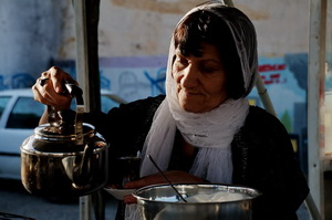 The woman selling tea.